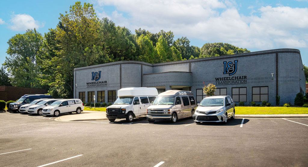 The I&J office building with the van fleet parked out front